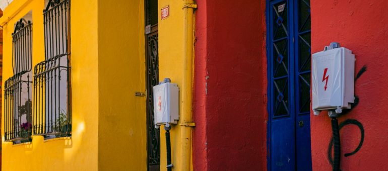 A vibrant scene of colorful buildings in Istanbul, showcasing yellow and red facades.